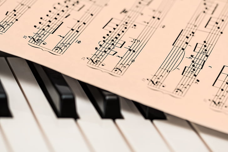 sheet music and piano